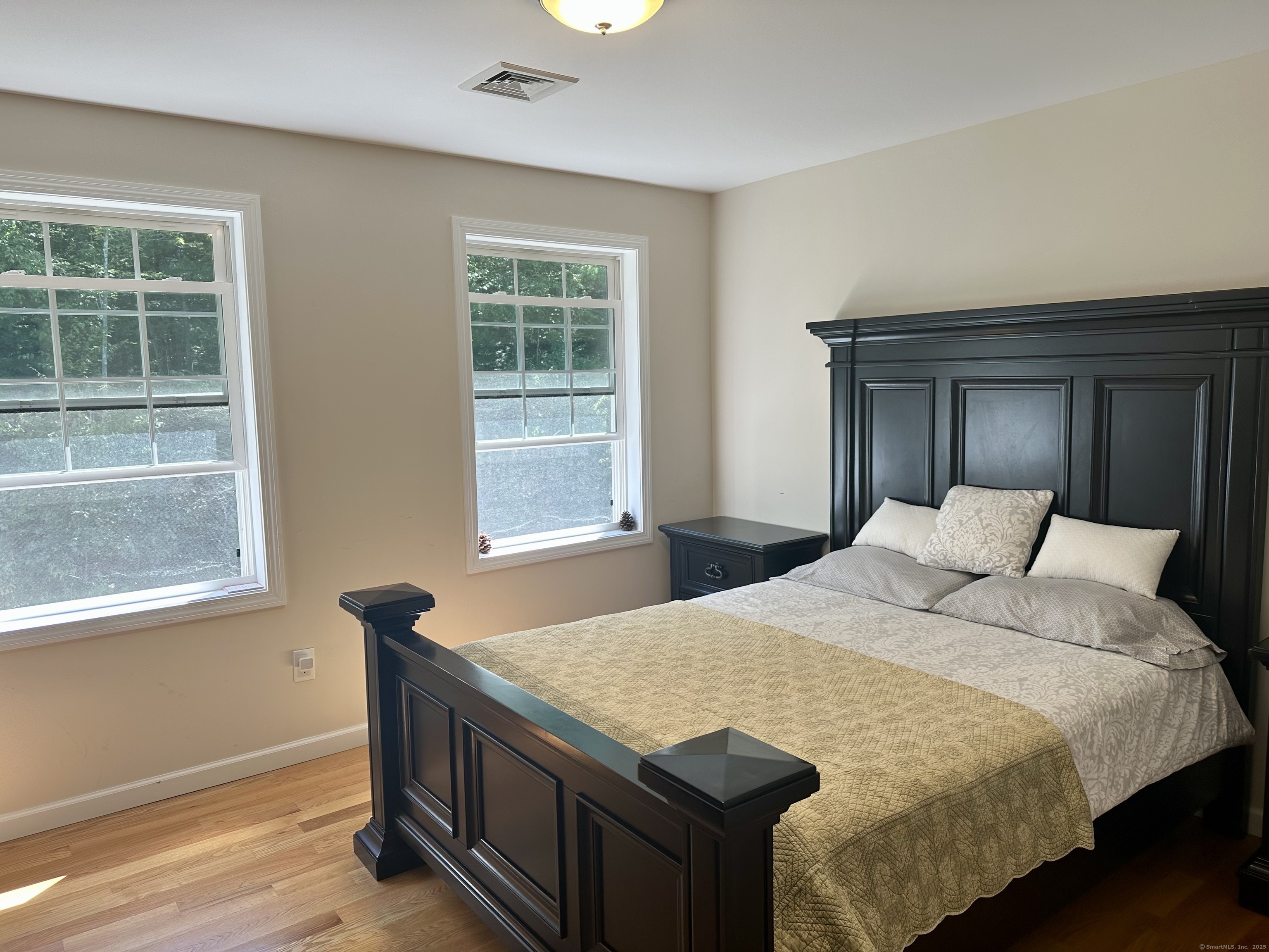 102 Pheasant Lane Granby, CT 06060 - Photo 15 of 33 a bedroom with a bed and a window