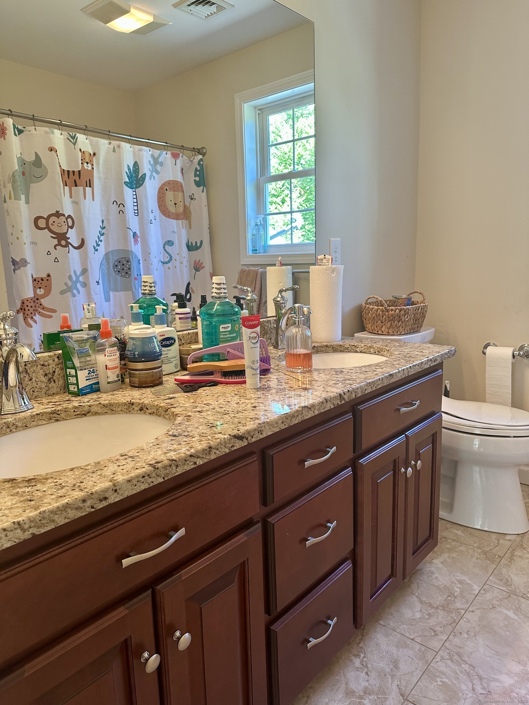 102 Pheasant Lane Granby, CT 06060 - Photo 18 of 33 a bathroom with a granite countertop sink a toilet and a window