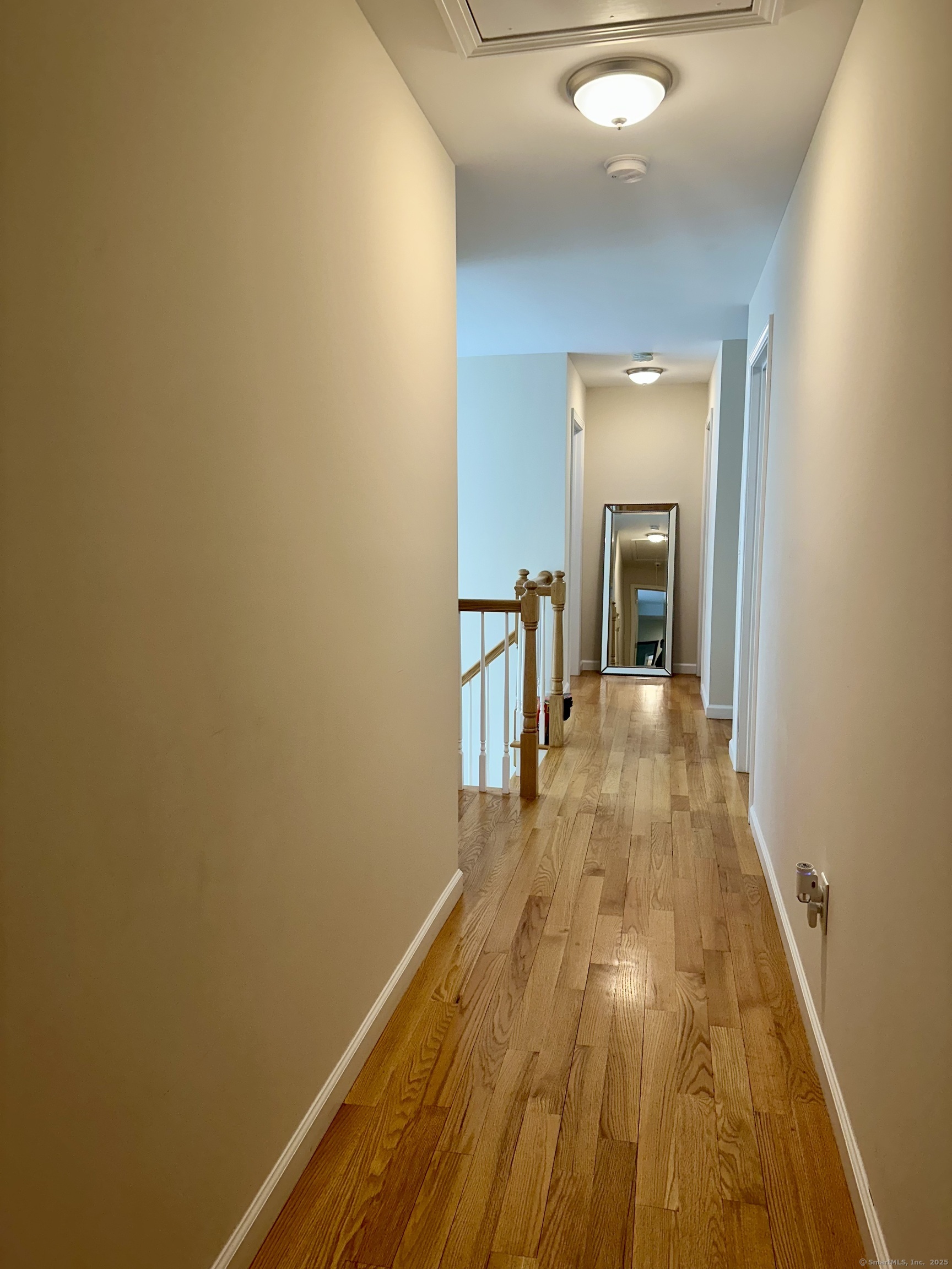 102 Pheasant Lane Granby, CT 06060 - Photo 20 of 33 a view of a room with wooden floor and furniture