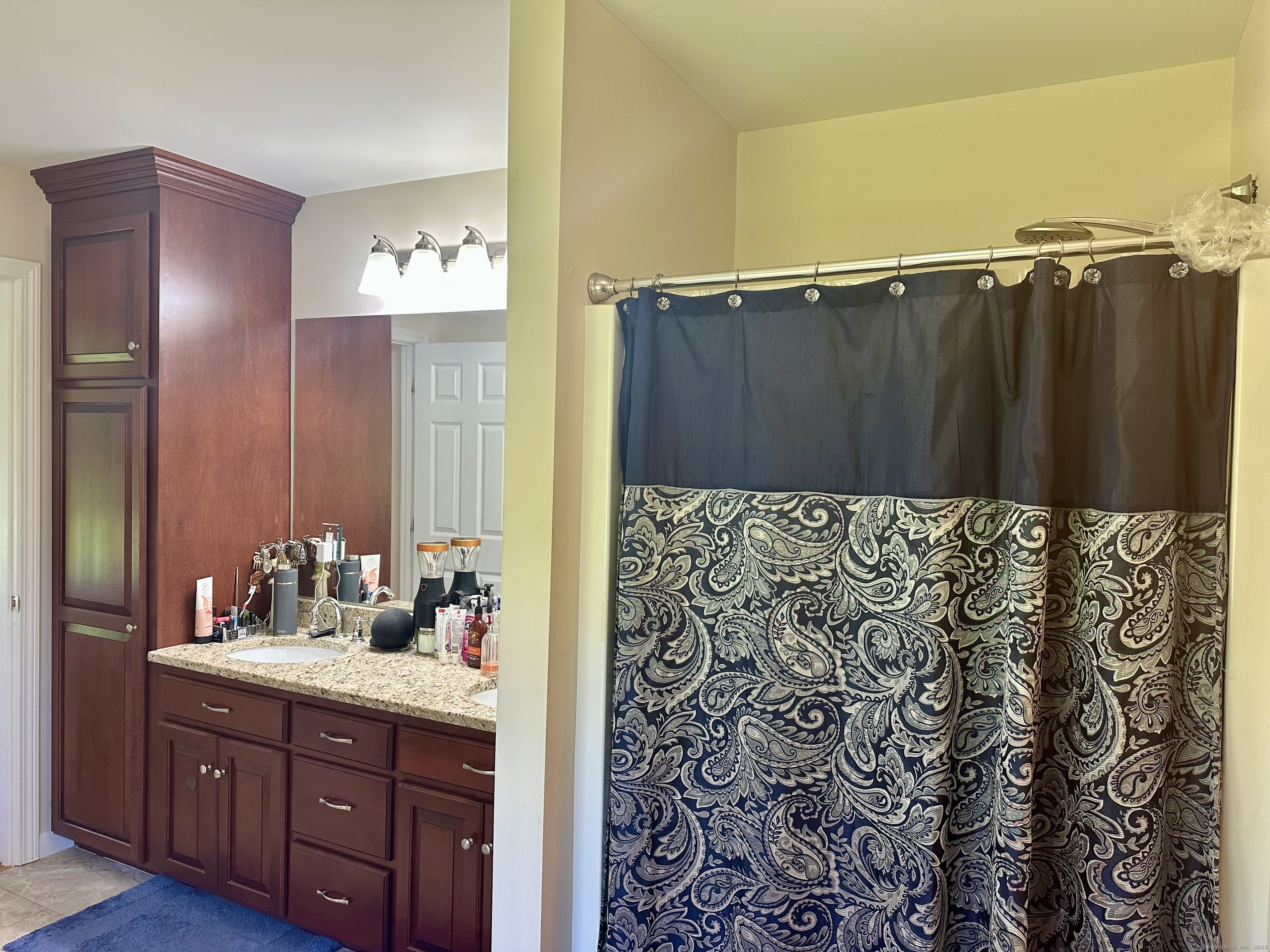 102 Pheasant Lane Granby, CT 06060 - Photo 22 of 33 a bathroom with a sink and a mirror
