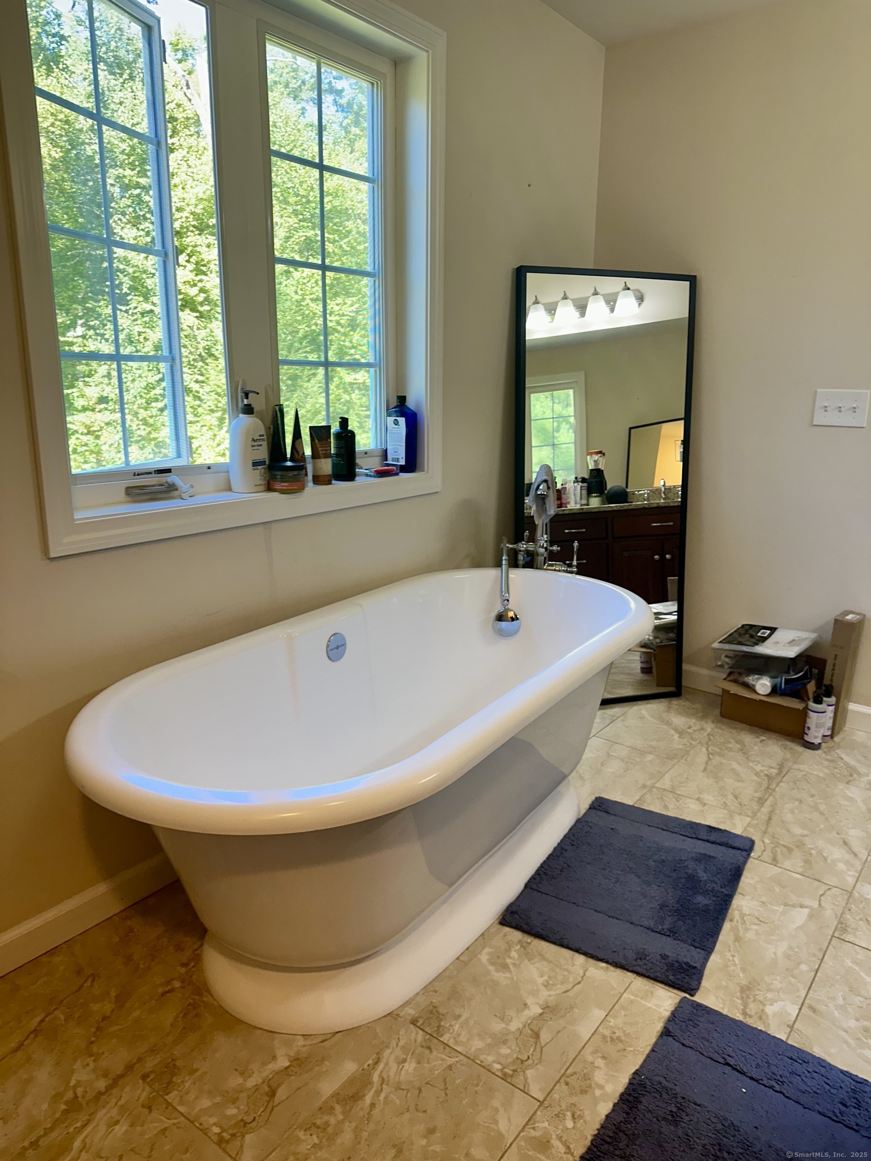 102 Pheasant Lane Granby, CT 06060 - Photo 23 of 33 a bathroom with a bathtub and window