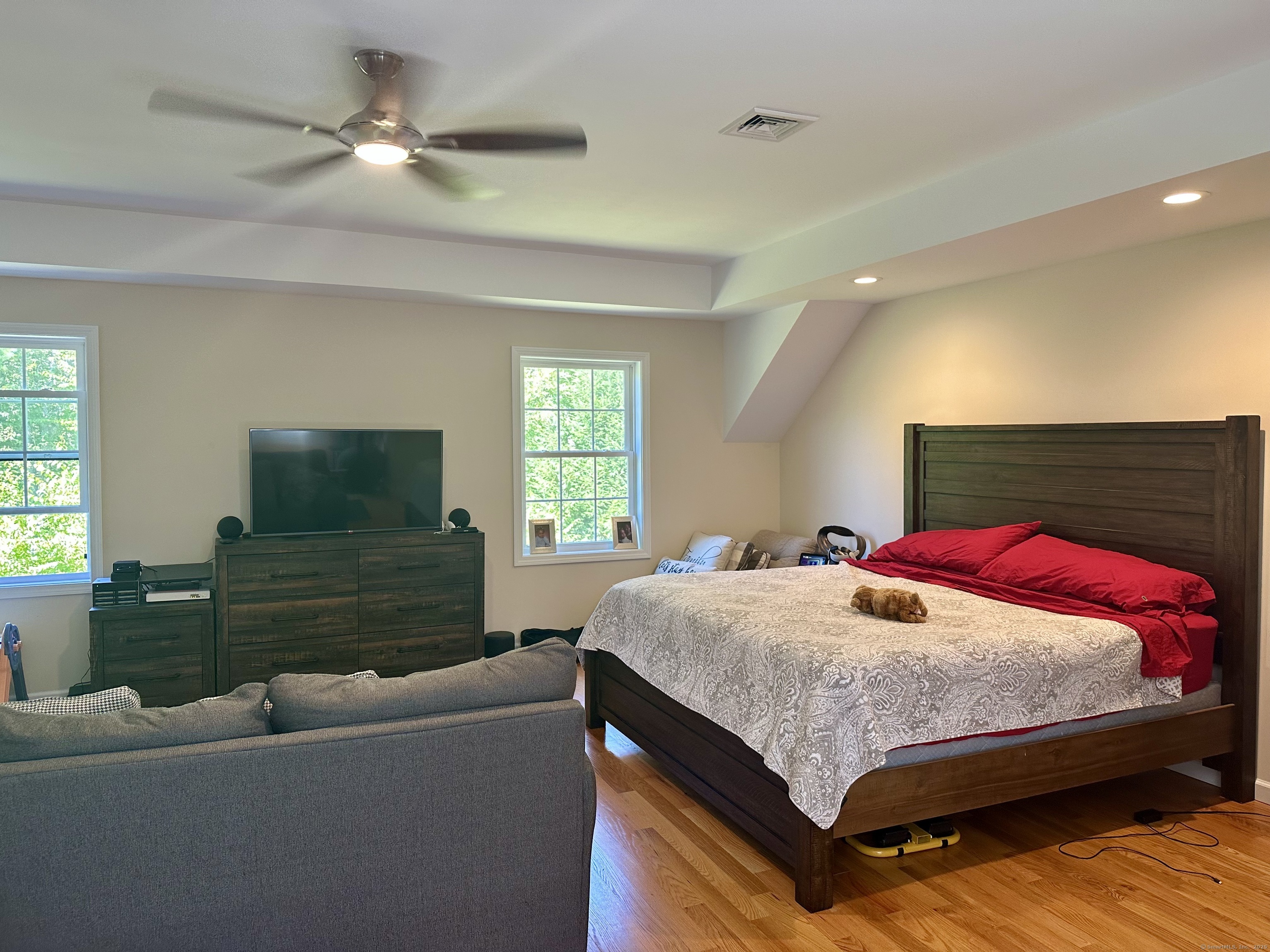 102 Pheasant Lane Granby, CT 06060 - Photo 26 of 33 a bedroom with a bed and a flat screen tv