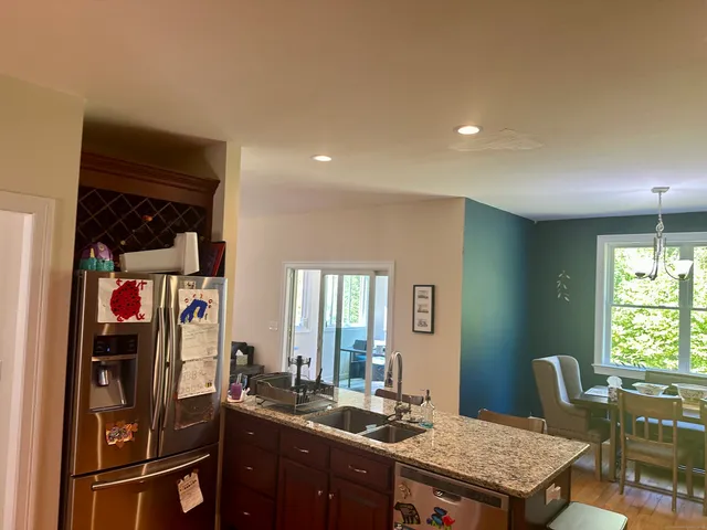 a kitchen with a table and chairs in it