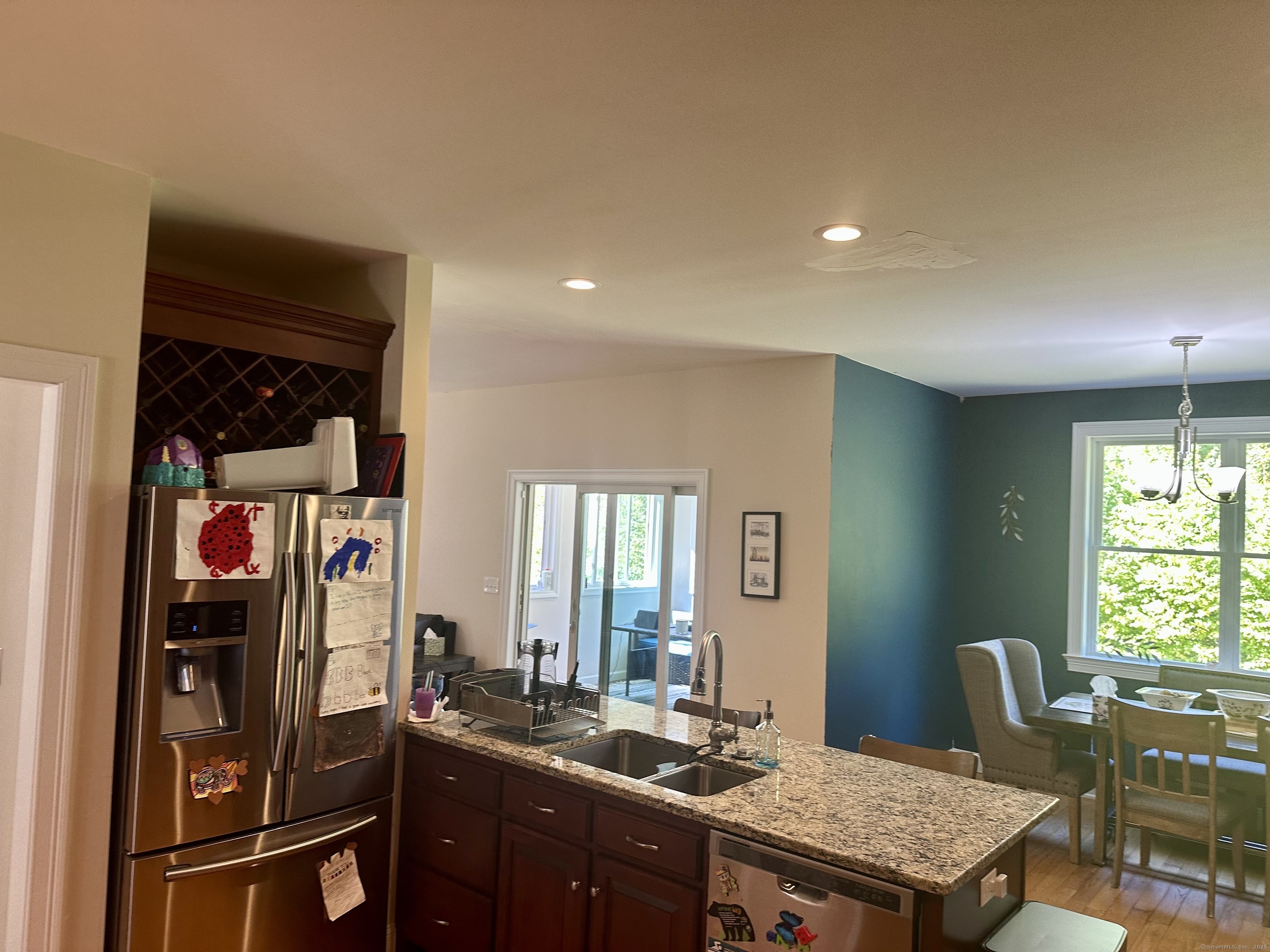 102 Pheasant Lane Granby, CT 06060 - Photo 3 of 33 a kitchen with a table and chairs in it