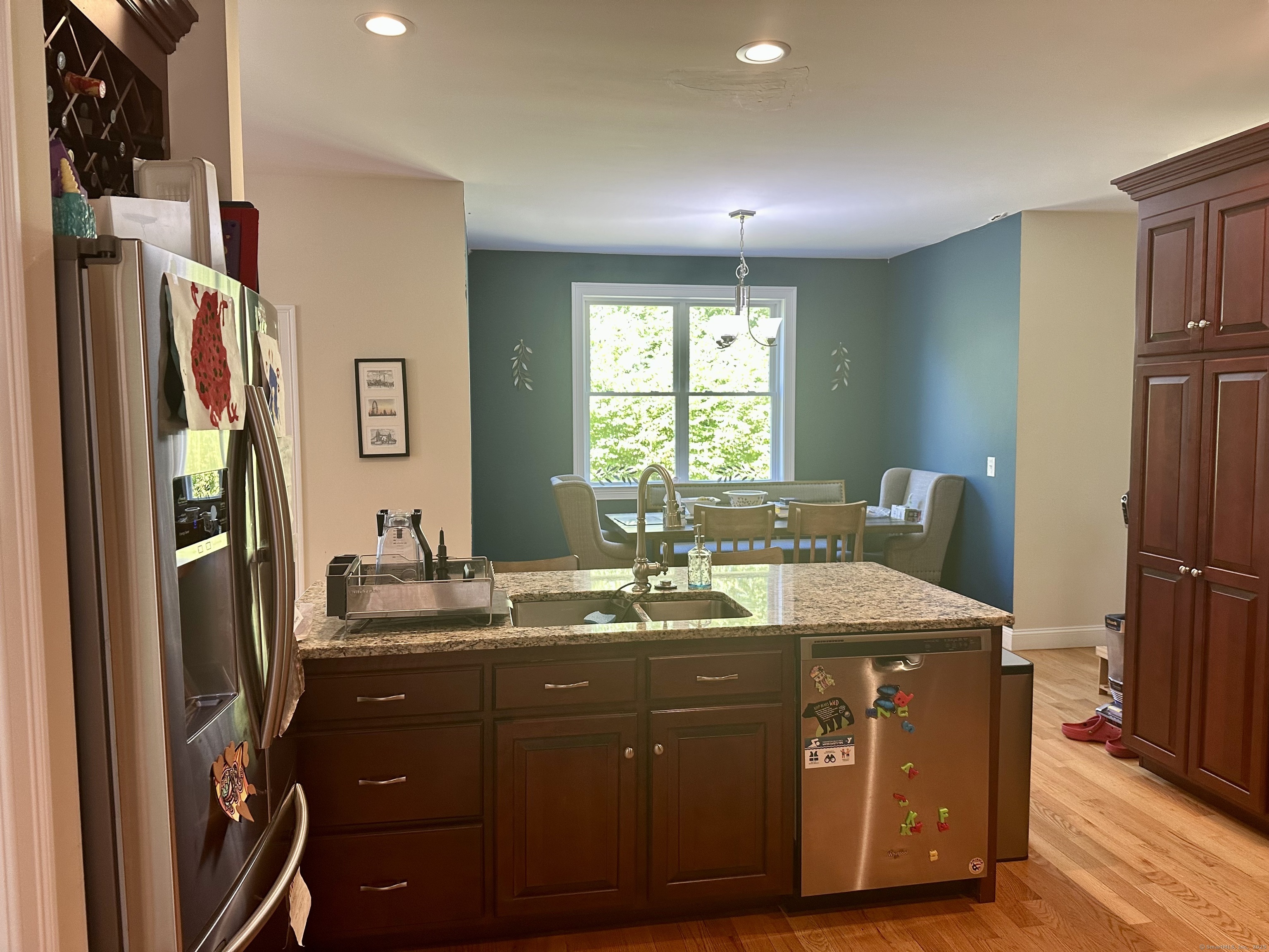102 Pheasant Lane Granby, CT 06060 - Photo 5 of 33 a room with a sink a refrigerator and a window