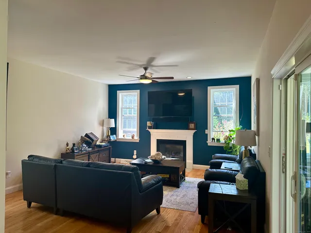 a living room with furniture and a fireplace