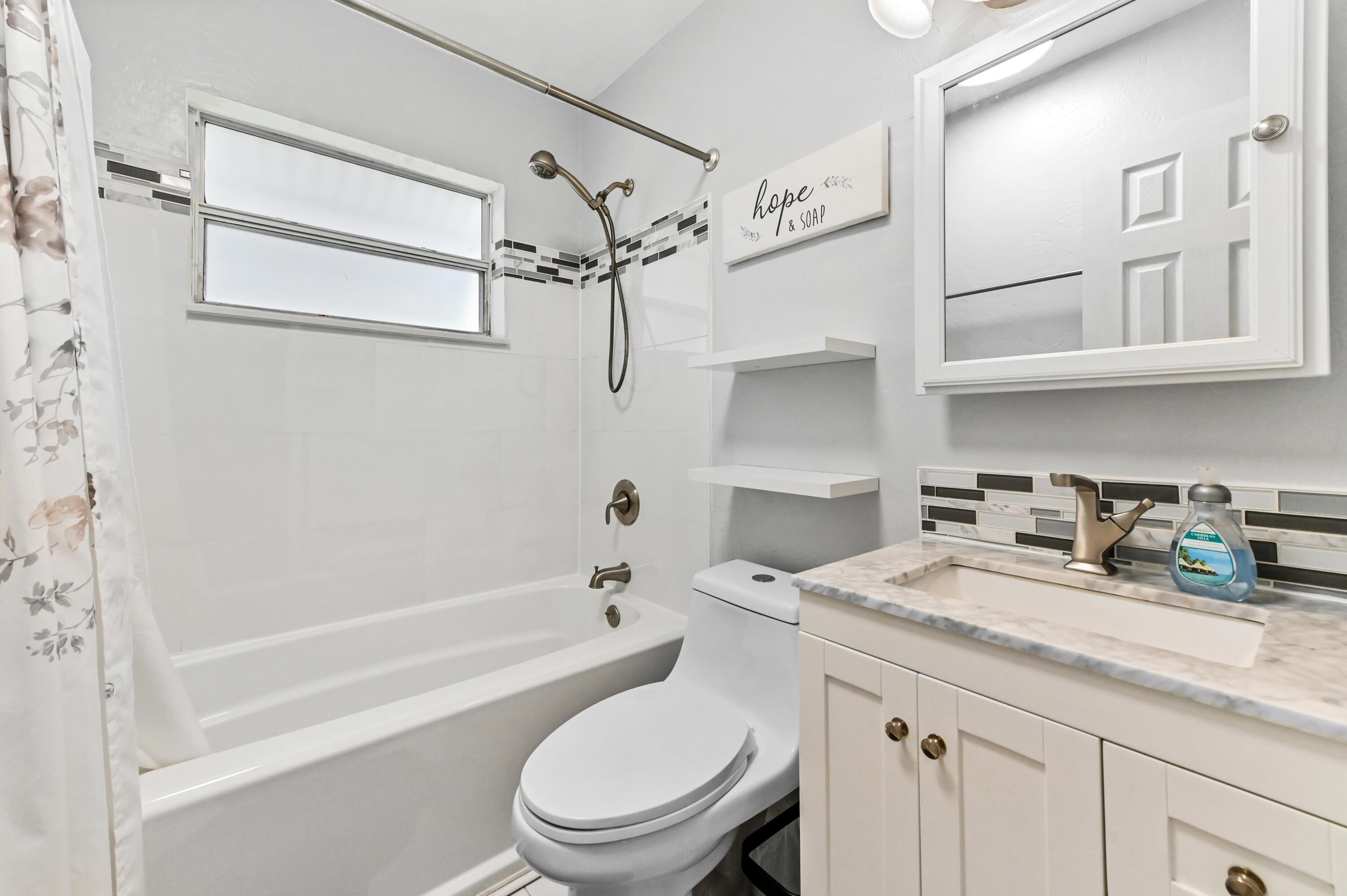 5709 Southeast Indigo Avenue Stuart, FL 34997 - Photo 16 of 24 18 Bathroom 01