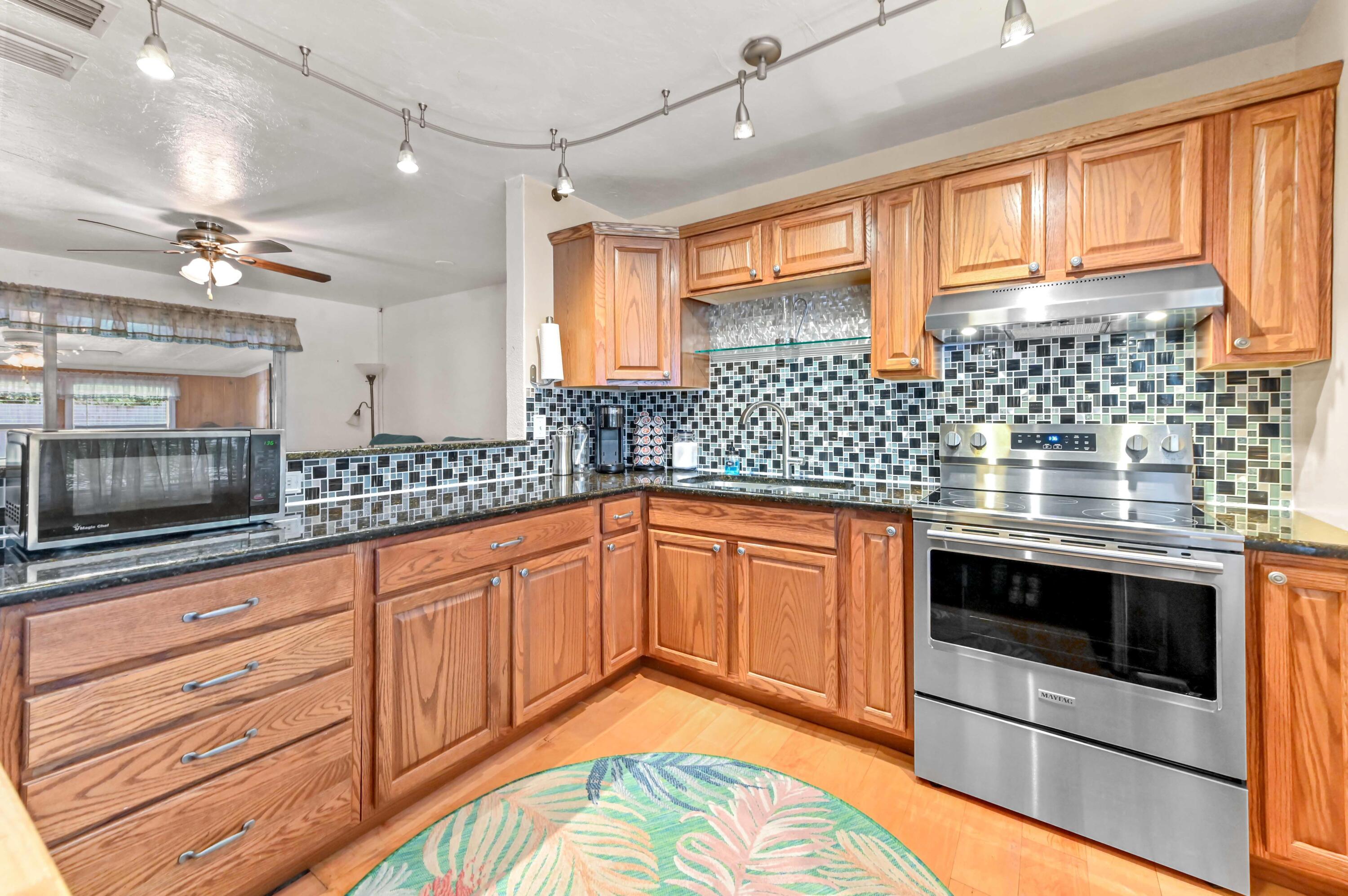 5709 Southeast Indigo Avenue Stuart, FL 34997 - Photo 3 of 24 05 Kitchen 02