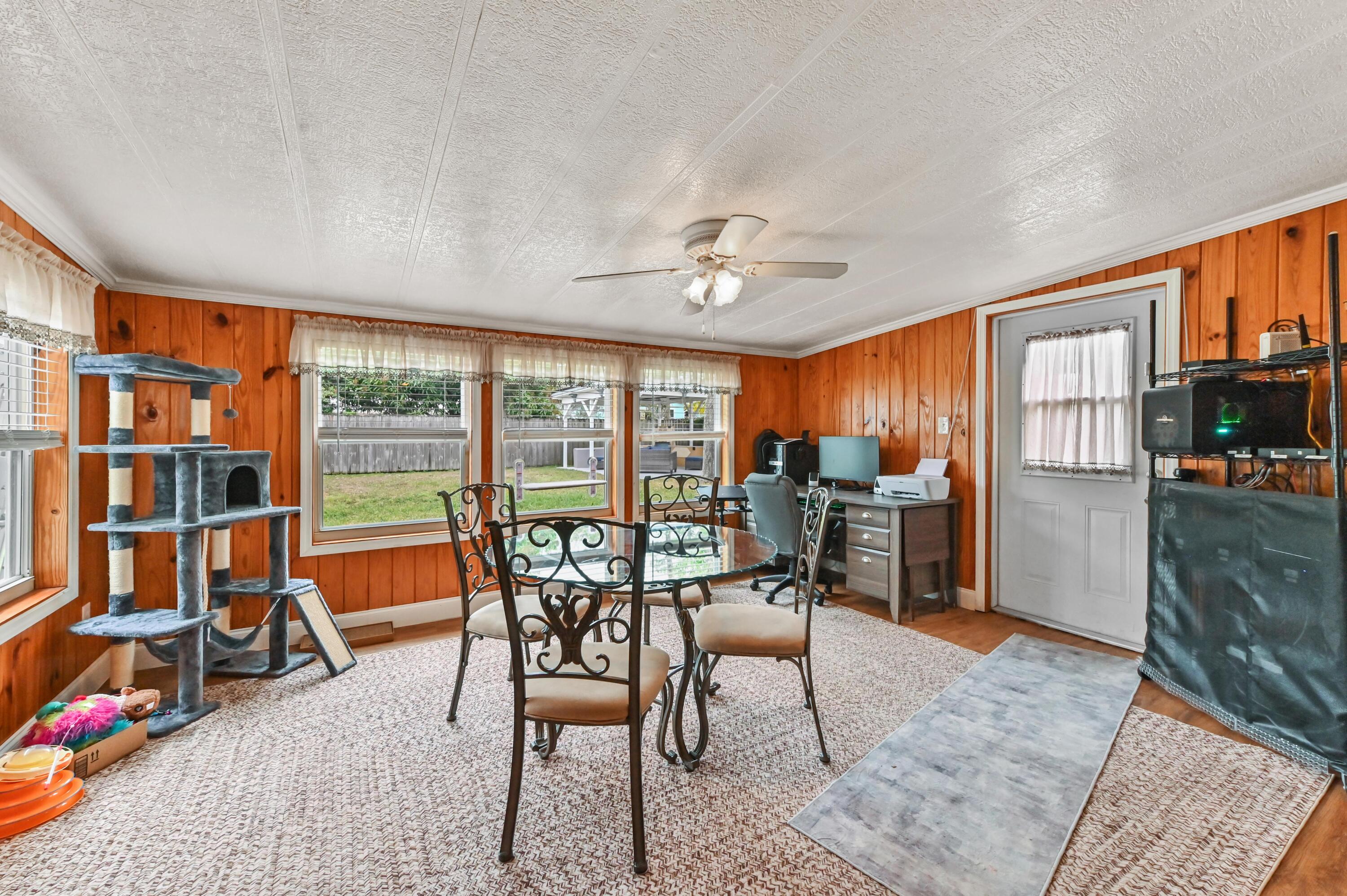 5709 Southeast Indigo Avenue Stuart, FL 34997 - Photo 9 of 24 10 Family room 01