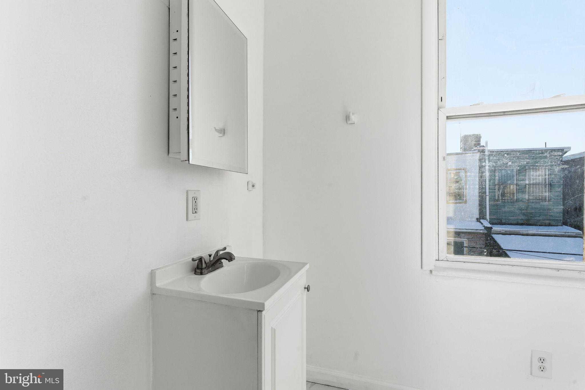 2236 West Firth Street Philadelphia, PA 19132 - Photo 10 of 13 Hall bath with lots of natural light