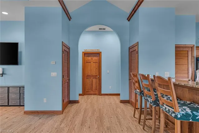 wooden floor in an empty room with windows