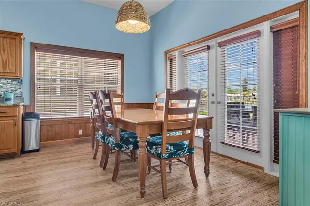 a view of a dining room with furniture window and wooden floor