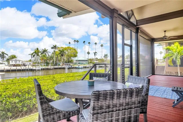 a view of swimming pool with outdoor seating