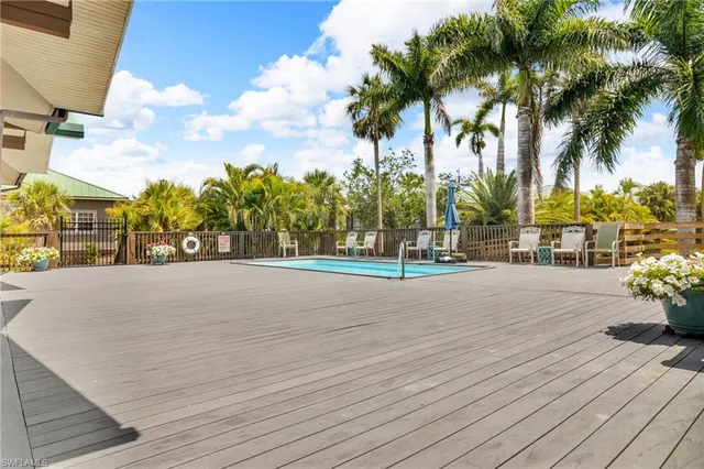 a view of a dining room with furniture and a chandelier