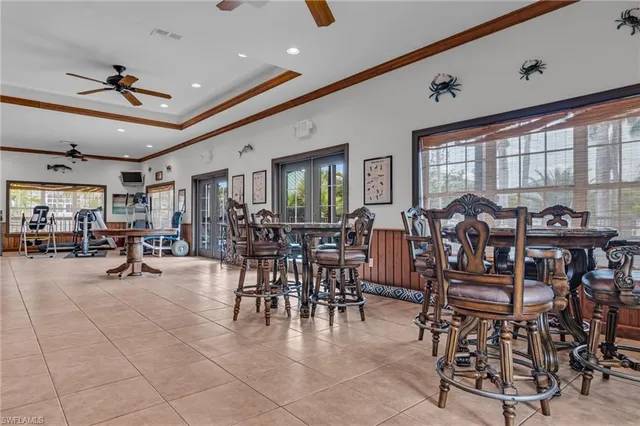 a living room with furniture a dining table and chairs