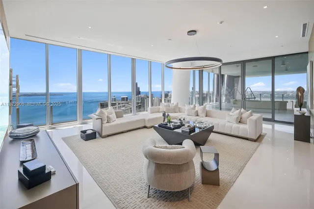 a kitchen with stainless steel appliances granite countertop a sink and a refrigerator