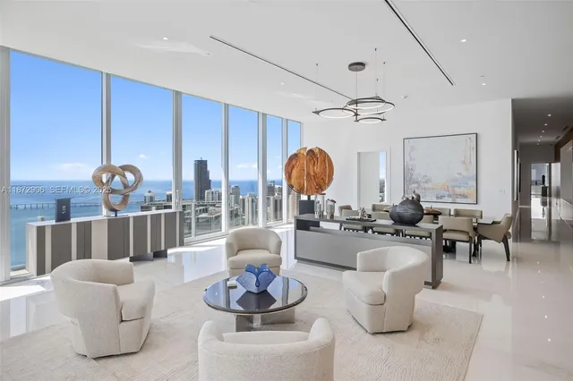 a bathroom with a white tub sitting next to a white sink and vanity