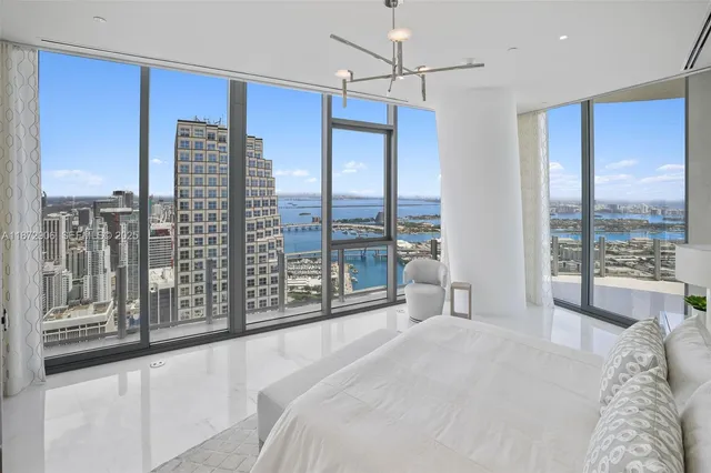 a bathroom with double vanity sink a mirror and shower