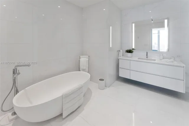 a view of a swimming pool and outdoor seating