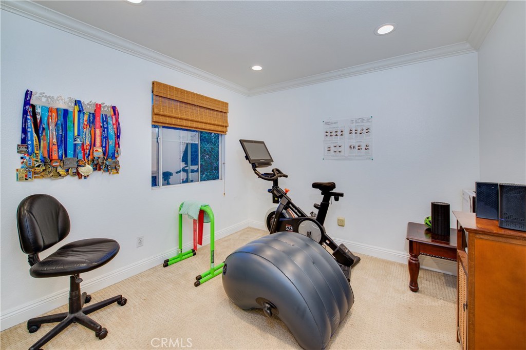 16163 Setting Sun Circle Riverside, CA 92503 - Photo 24 of 36 a view of a workspace with furniture and a window