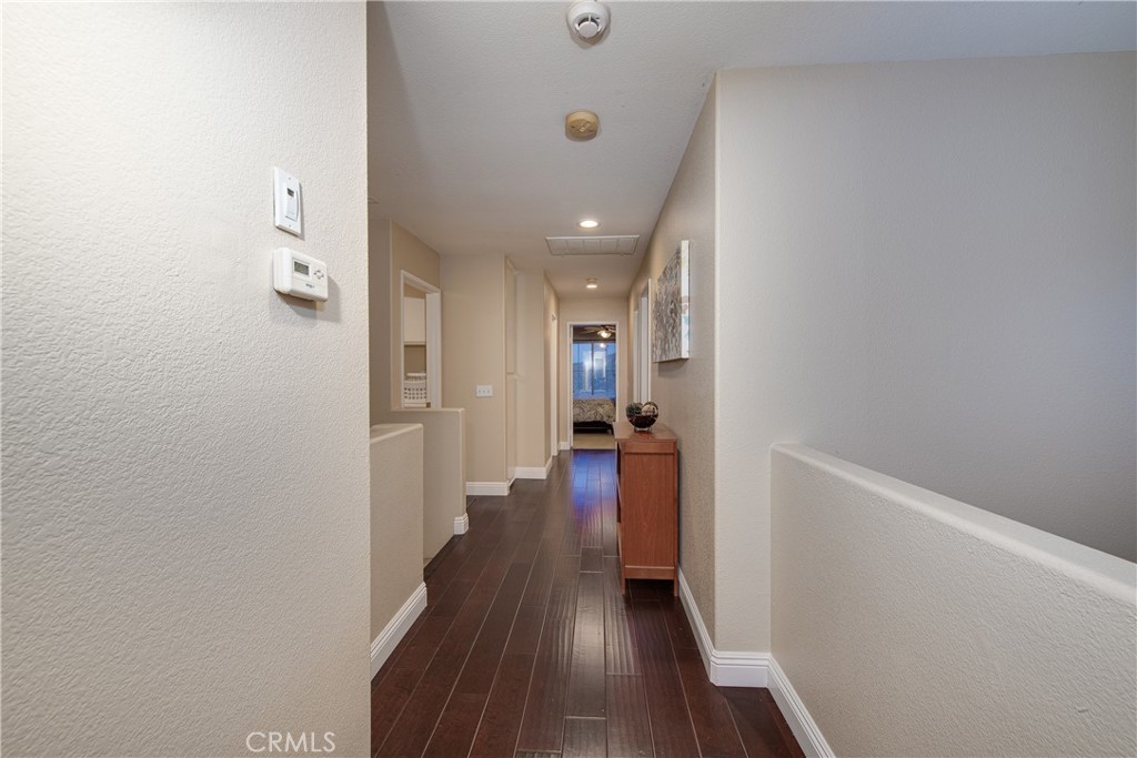 16163 Setting Sun Circle Riverside, CA 92503 - Photo 28 of 36 a view of a hallway with wooden floor