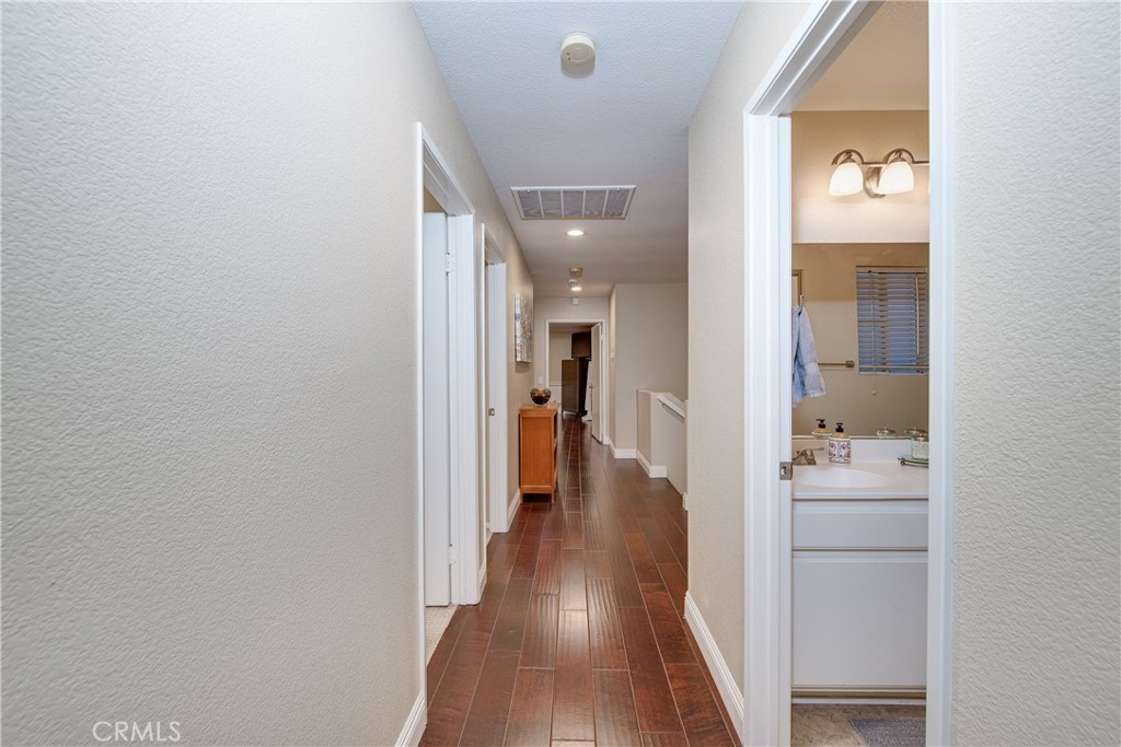 16163 Setting Sun Circle Riverside, CA 92503 - Photo 29 of 36 a view of a hallway with wooden floor windows and livingroom