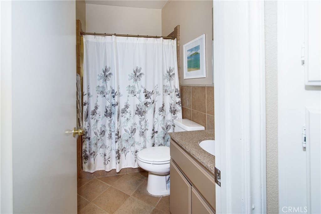 16163 Setting Sun Circle Riverside, CA 92503 - Photo 10 of 36 a bathroom with a toilet and a shower