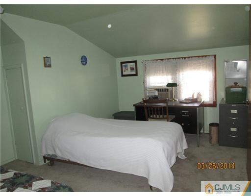 19 Montview Road Edison, NJ 08837 - Photo 11 of 15 a bedroom with a bed and a dresser