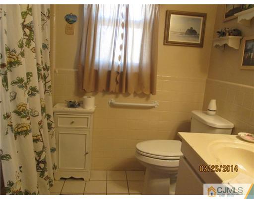 19 Montview Road Edison, NJ 08837 - Photo 12 of 15 a bathroom with a toilet sink and shower