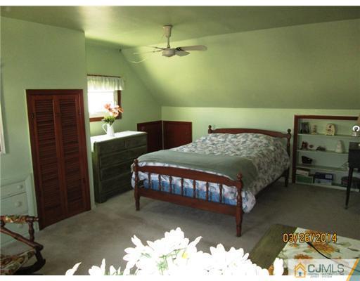 19 Montview Road Edison, NJ 08837 - Photo 7 of 15 a bedroom with a bed window and a dresser