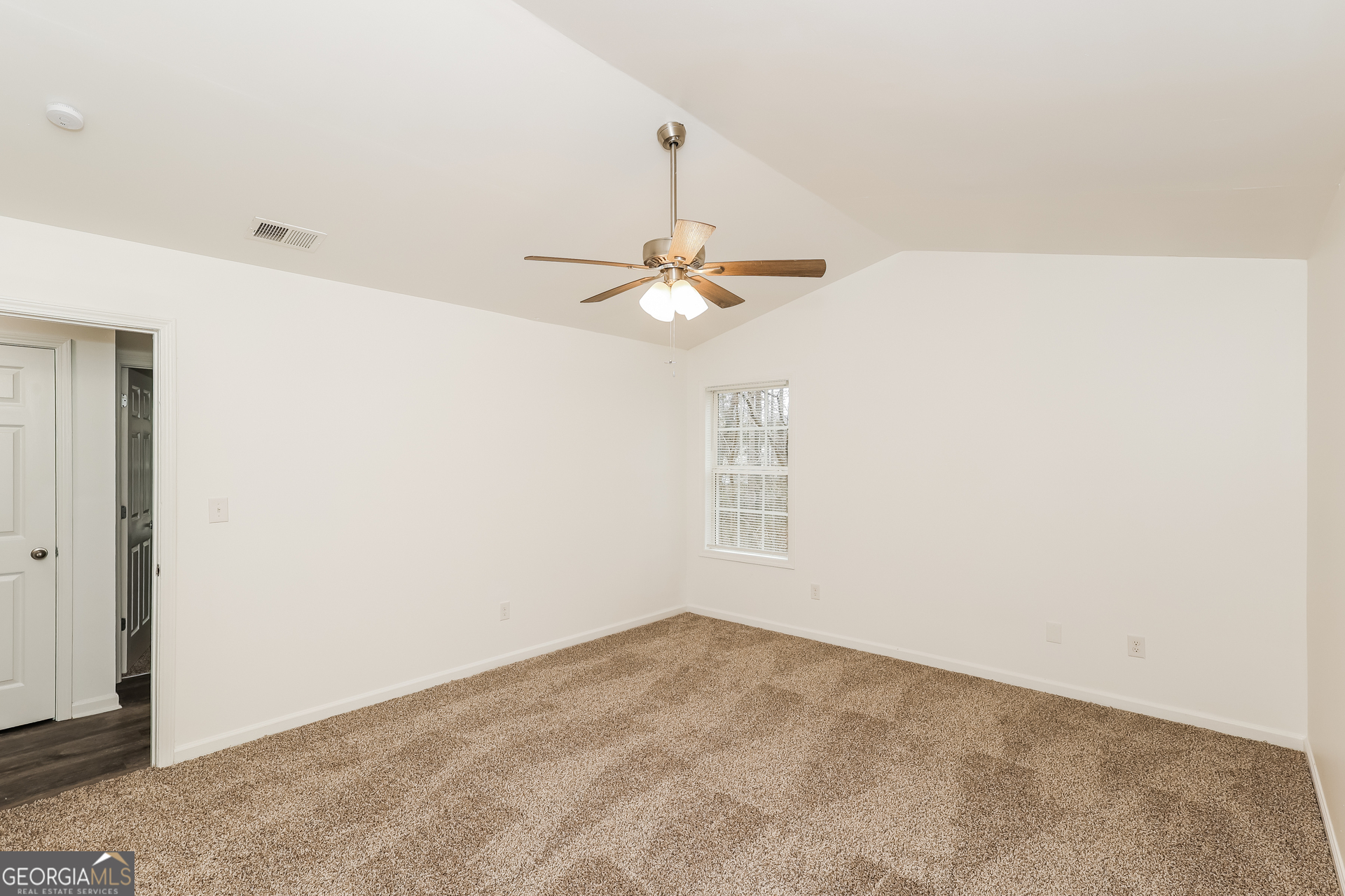 138 Pope Lane Newnan, GA 30263 - Photo 15 of 25 a view of a room with a ceiling fan and a window