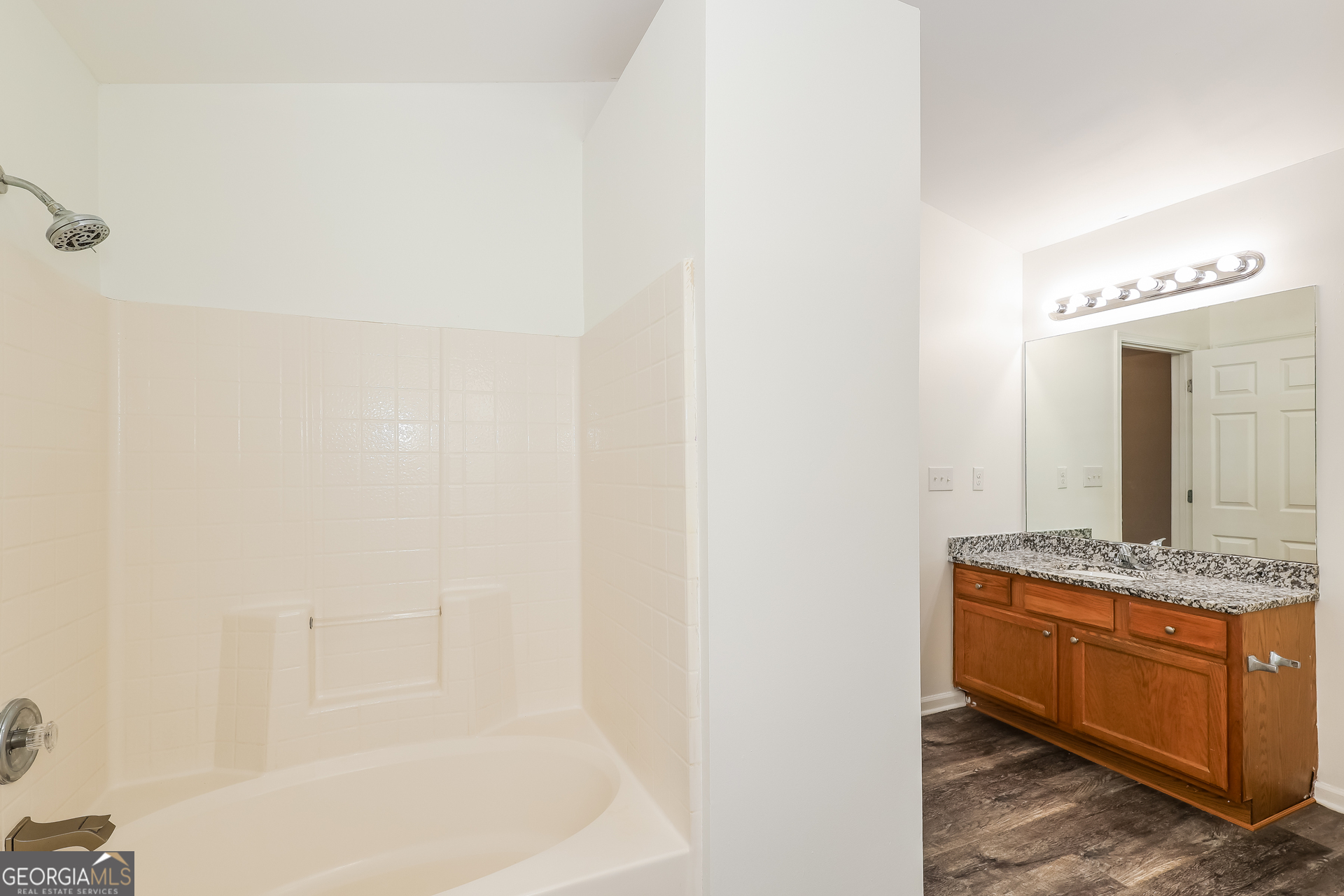 138 Pope Lane Newnan, GA 30263 - Photo 16 of 25 a bathroom with a granite countertop sink and a mirror