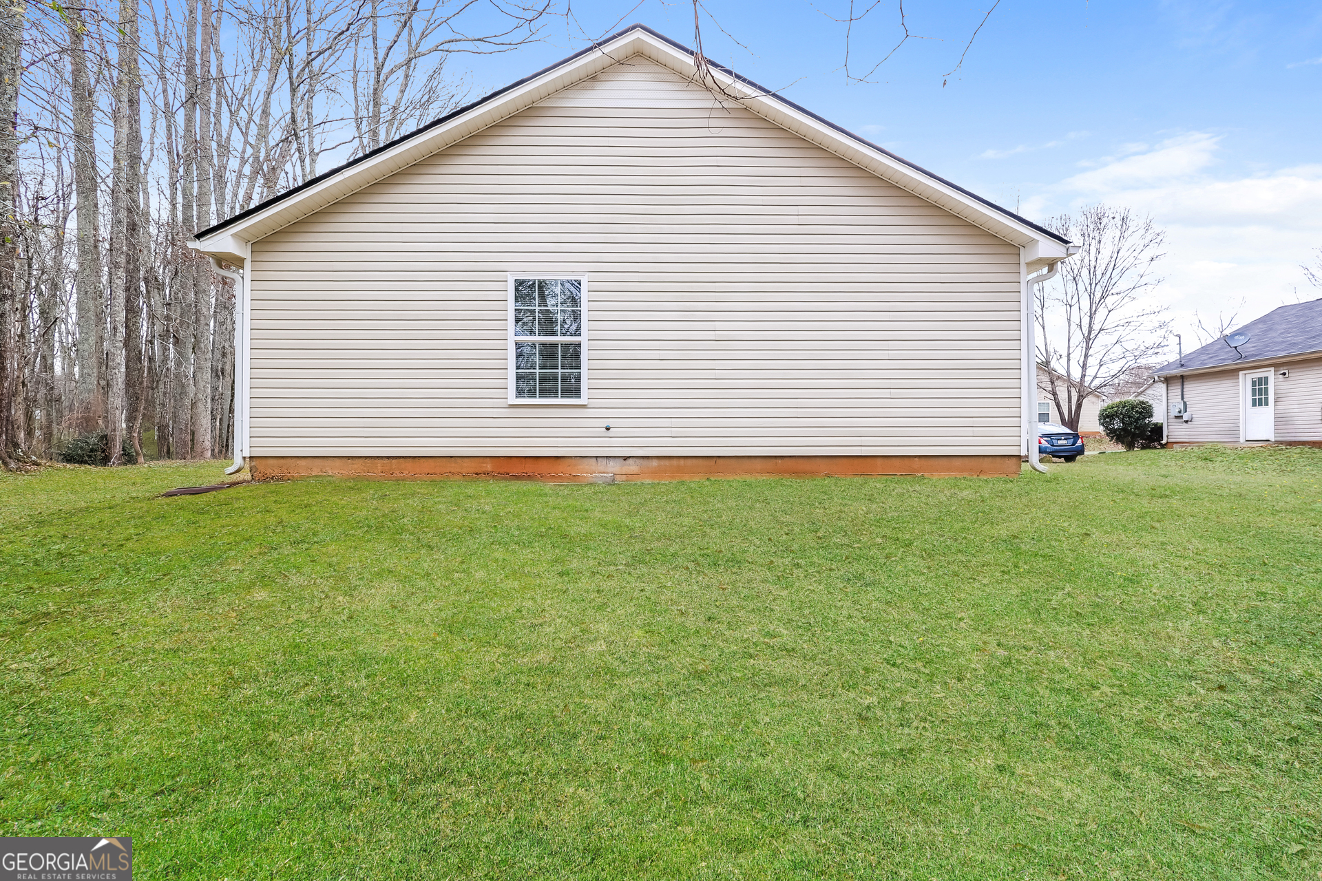 138 Pope Lane Newnan, GA 30263 - Photo 23 of 25 a view of a house with a backyard
