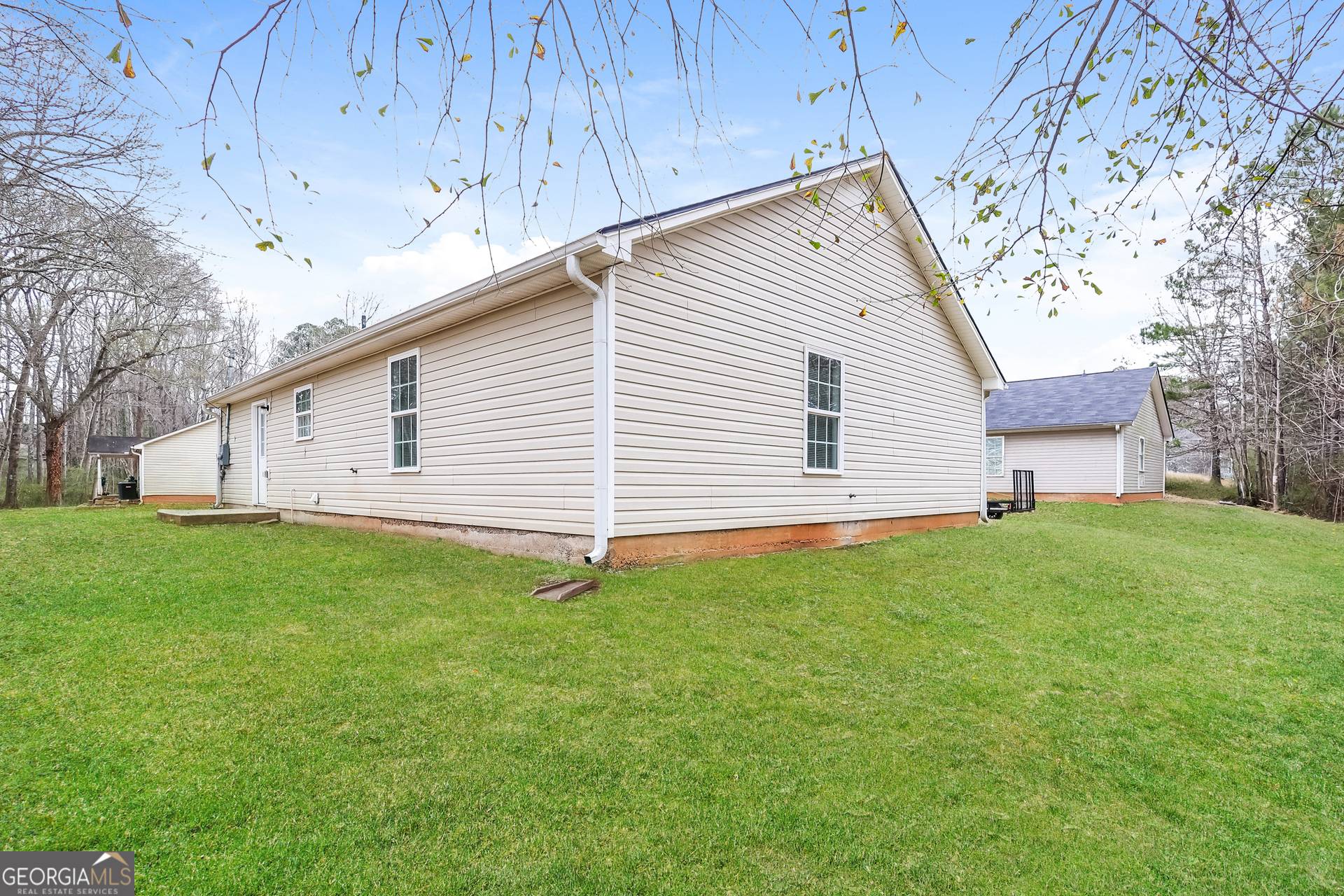 138 Pope Lane Newnan, GA 30263 - Photo 25 of 25 a view of a backyard with plants and a garden