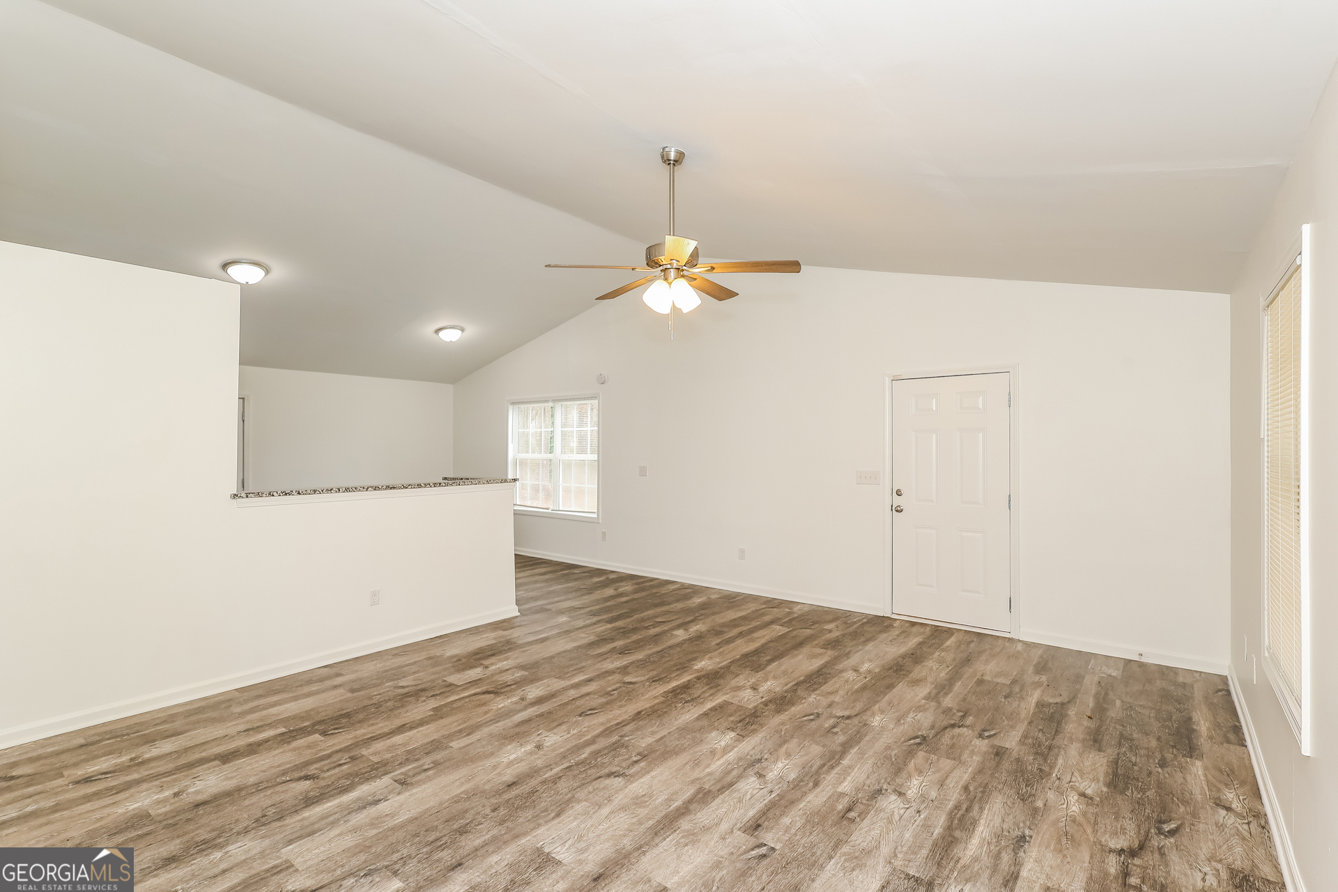 138 Pope Lane Newnan, GA 30263 - Photo 5 of 25 a view of a livingroom with a chandelier fan