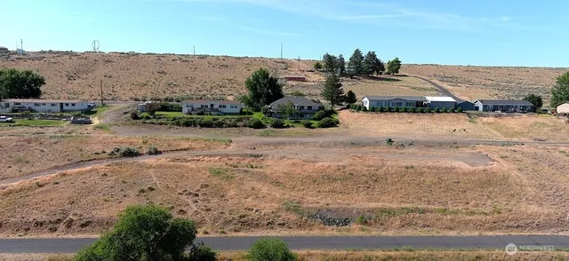 a view of ocean beach and mountain