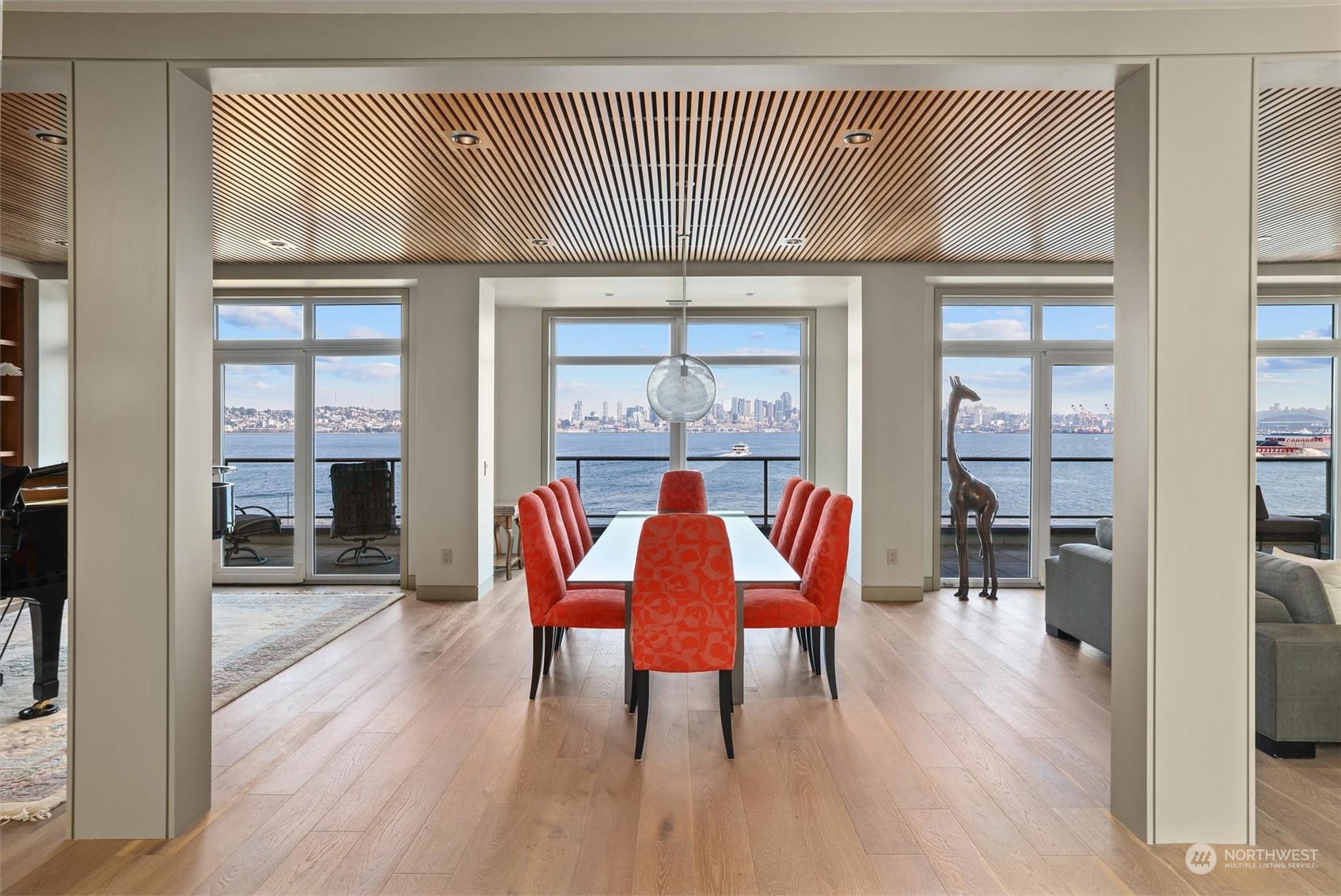 1661 Harbor Avenue Southwest, Unit 600 Seattle, WA 98126 - Photo 11 of 40 a dining room with furniture a chandelier and wooden floor