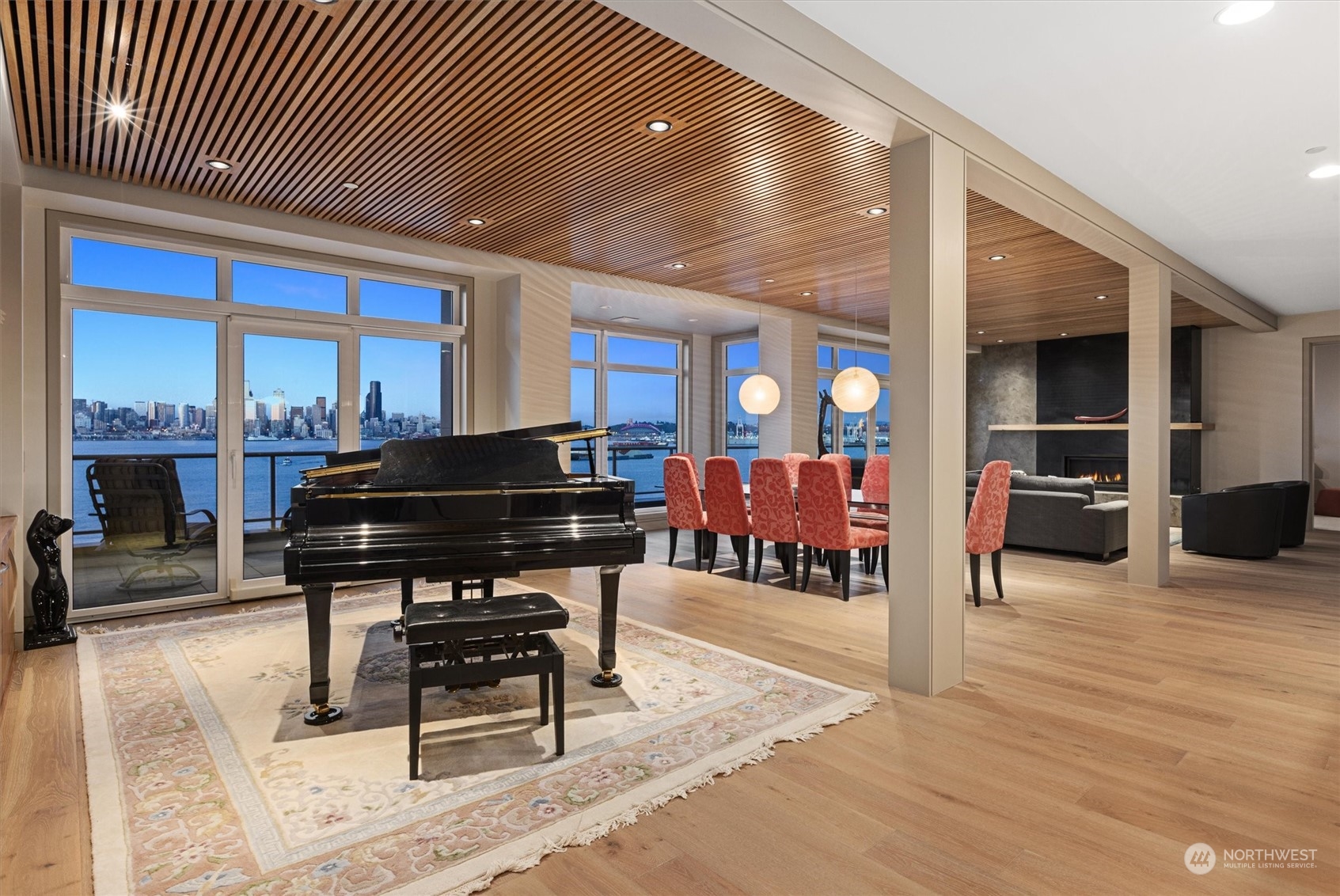 1661 Harbor Avenue Southwest, Unit 600 Seattle, WA 98126 - Photo 13 of 40 a living room with furniture a piano and a fireplace