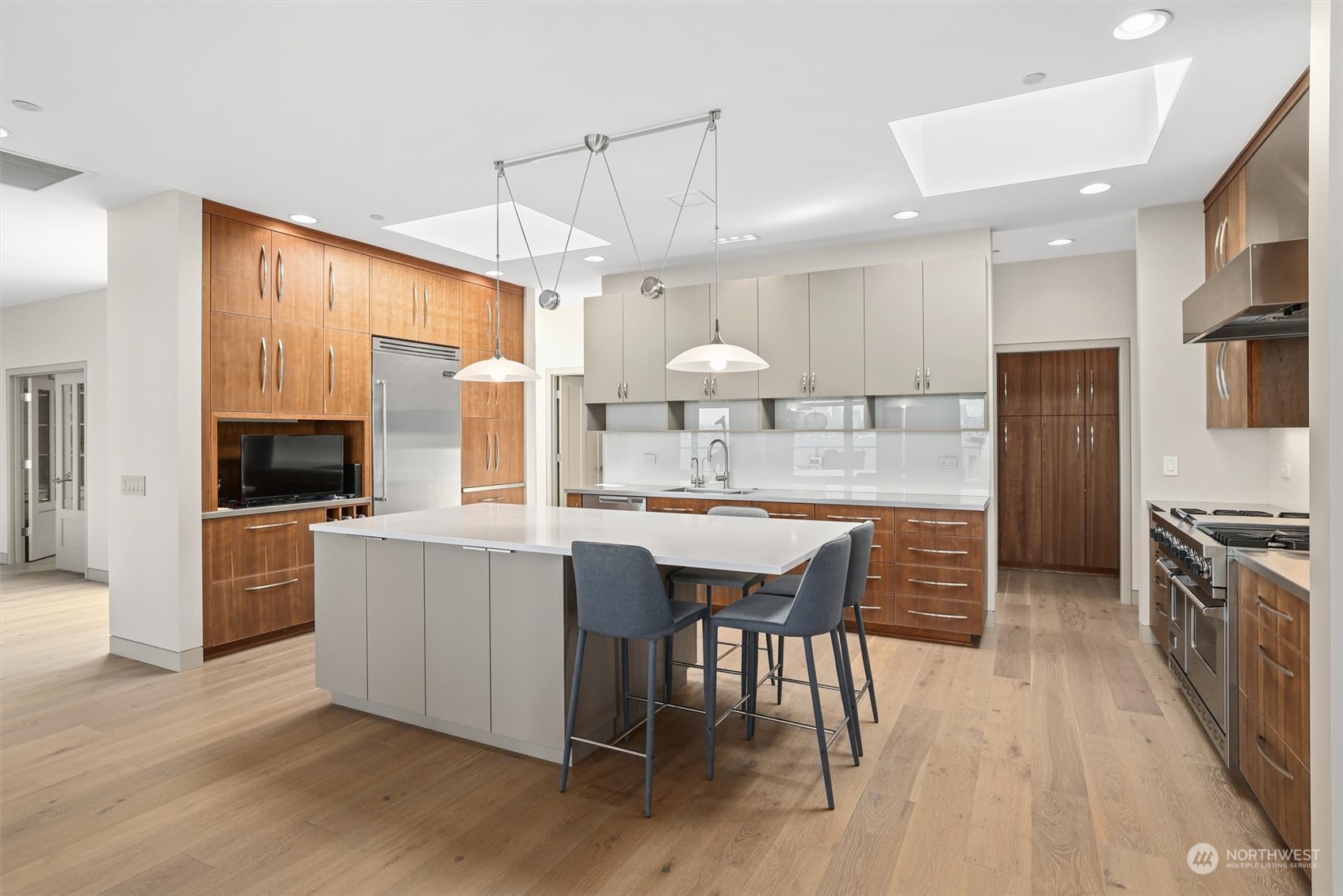 1661 Harbor Avenue Southwest, Unit 600 Seattle, WA 98126 - Photo 15 of 40 a large kitchen with a table and chairs
