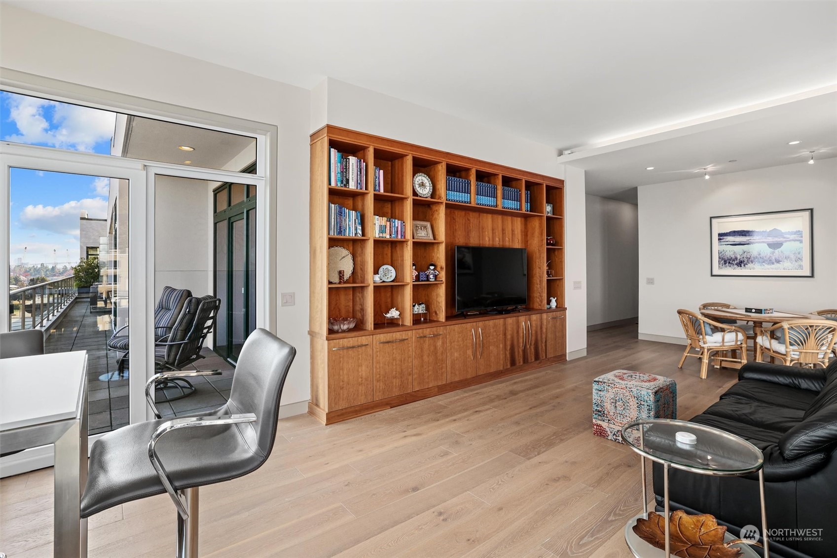 1661 Harbor Avenue Southwest, Unit 600 Seattle, WA 98126 - Photo 21 of 40 a living room with furniture and a flat screen tv