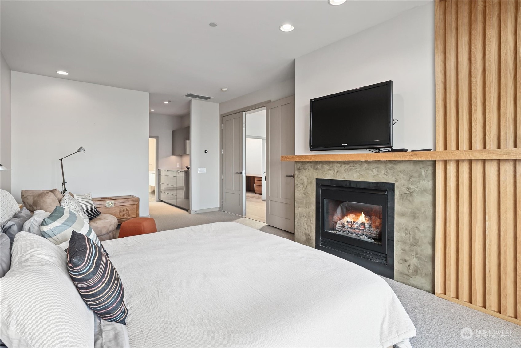 1661 Harbor Avenue Southwest, Unit 600 Seattle, WA 98126 - Photo 26 of 40 a bed room with a fireplace and a television