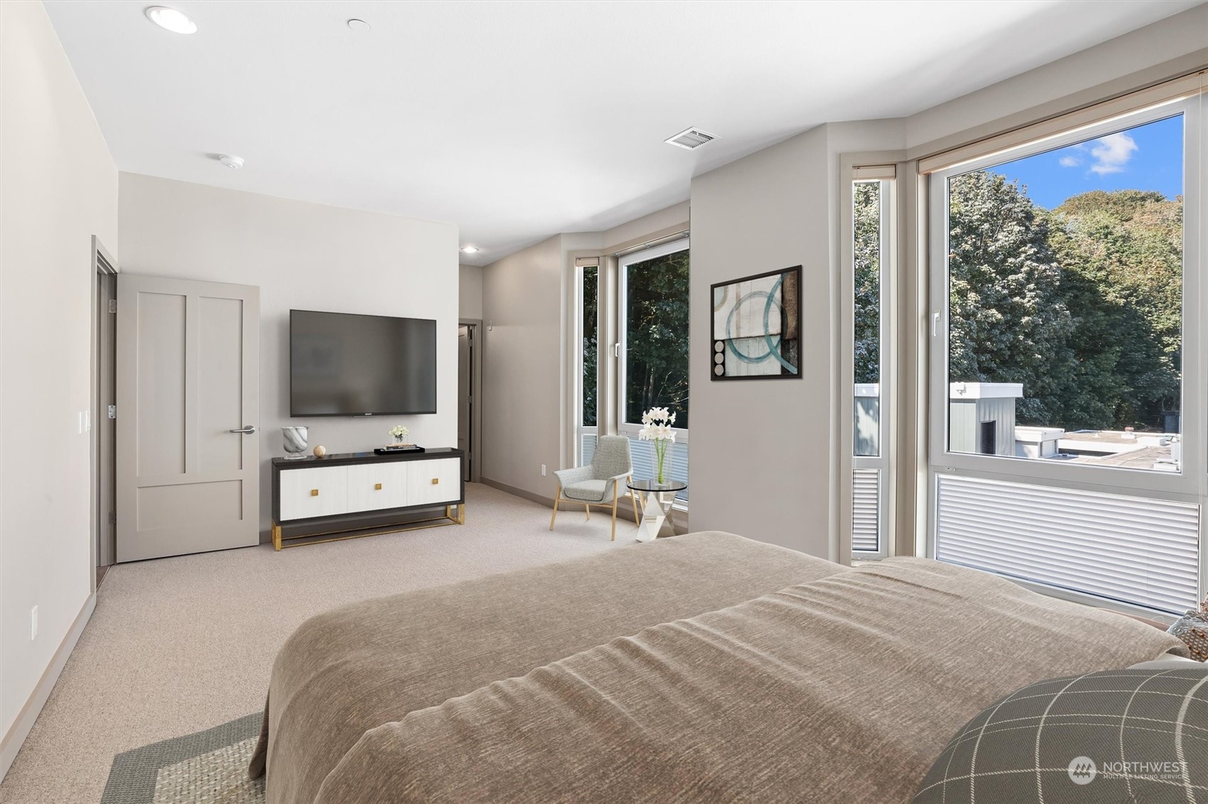 1661 Harbor Avenue Southwest, Unit 600 Seattle, WA 98126 - Photo 30 of 40 a bedroom with a bed and a flat screen tv