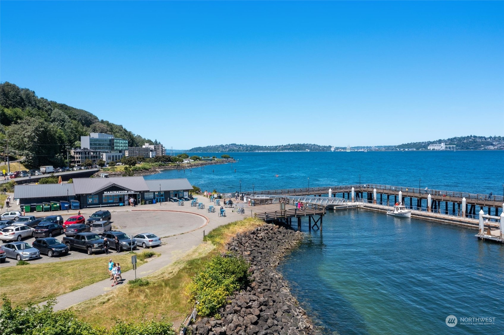 1661 Harbor Avenue Southwest, Unit 600 Seattle, WA 98126 - Photo 34 of 40 a view of a ocean with boats and trees in the background