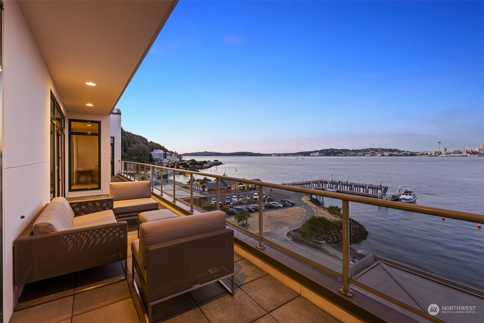 1661 Harbor Avenue Southwest, Unit 600 Seattle, WA 98126 - Photo 6 of 40 a view of a roof deck with couches and wooden floor