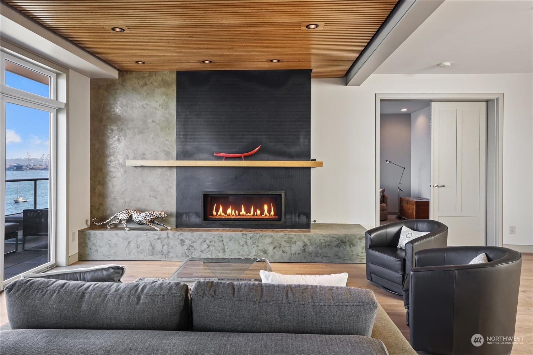 1661 Harbor Avenue Southwest, Unit 600 Seattle, WA 98126 - Photo 10 of 40 a living room with furniture and a fireplace