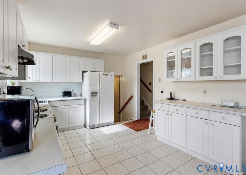 9003 Hungary Road Henrico, VA 23294 - Photo 12 of 25 Kitchen featuring white cabinetry, light-toned cou