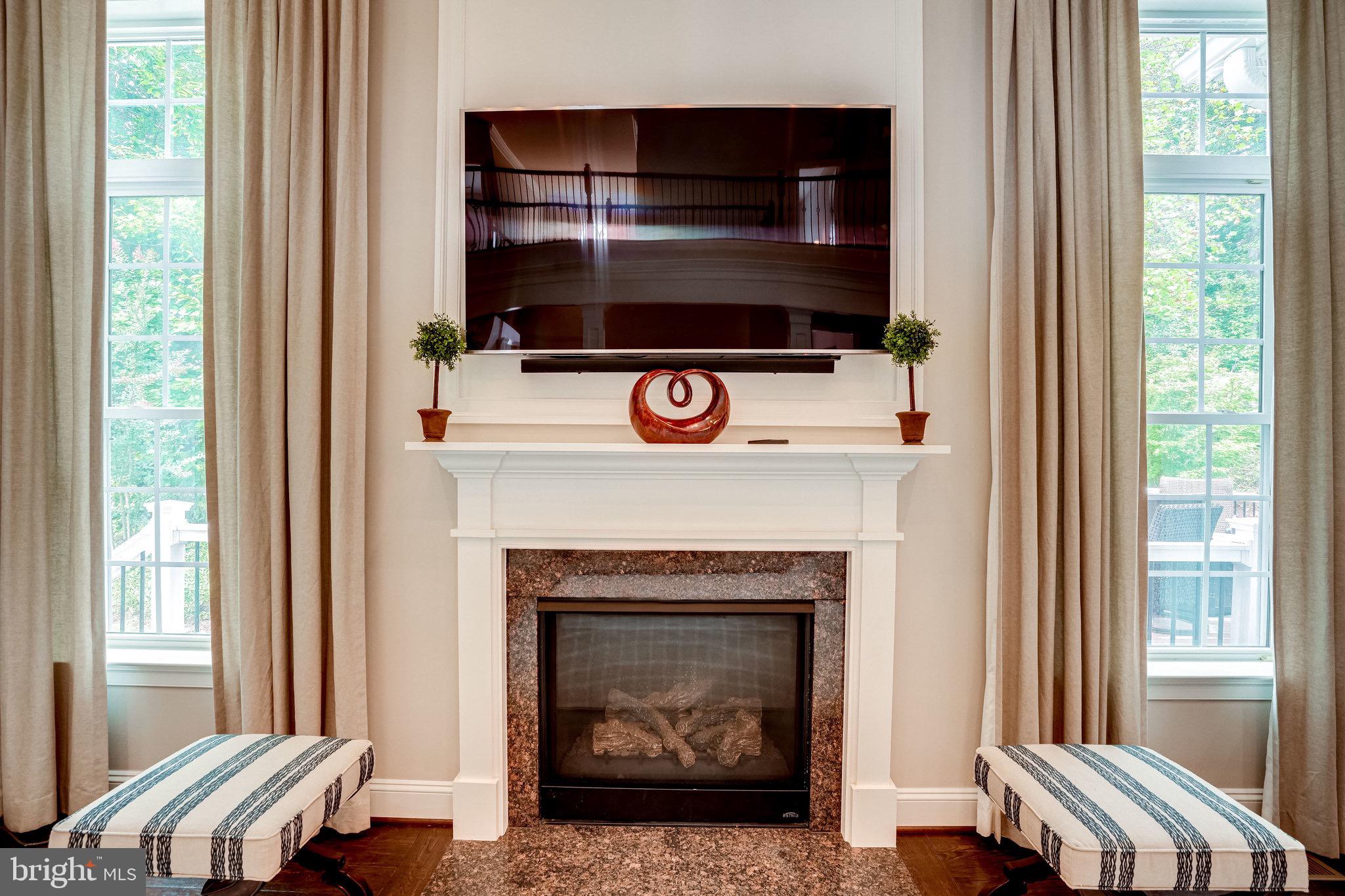 7561 Glen Pointe Court Springfield, VA 22153 - Photo 23 of 67 Cozy Gas Fireplace with Slate Surround