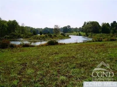 a view of lake with green space