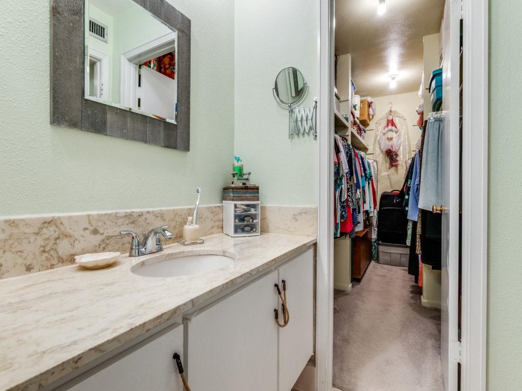 10755 Villager Road, Unit B Dallas, TX 75230 - Photo 13 of 24 a bathroom with a sink and mirror