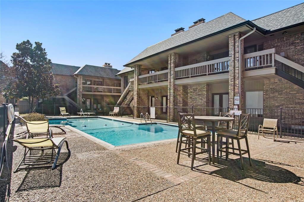 10755 Villager Road, Unit B Dallas, TX 75230 - Photo 20 of 24 a view of a patio with a table and chairs